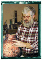 Dr. Patrick McGovern peering into the world's oldest wine jar